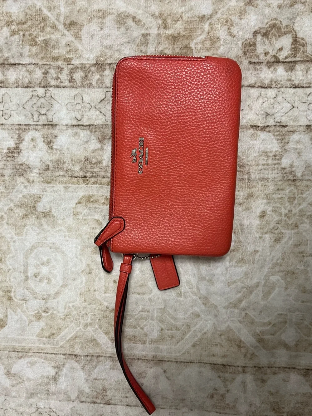 Coach Pebbled Leather Wristlet in Salmon